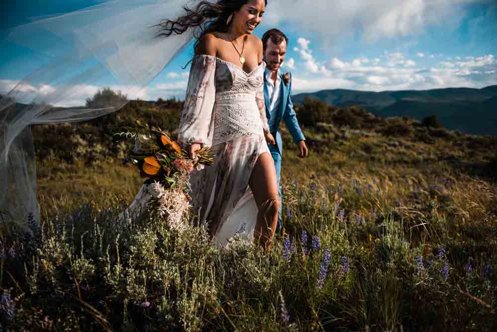 bride and groom walking during an elopement in colorado