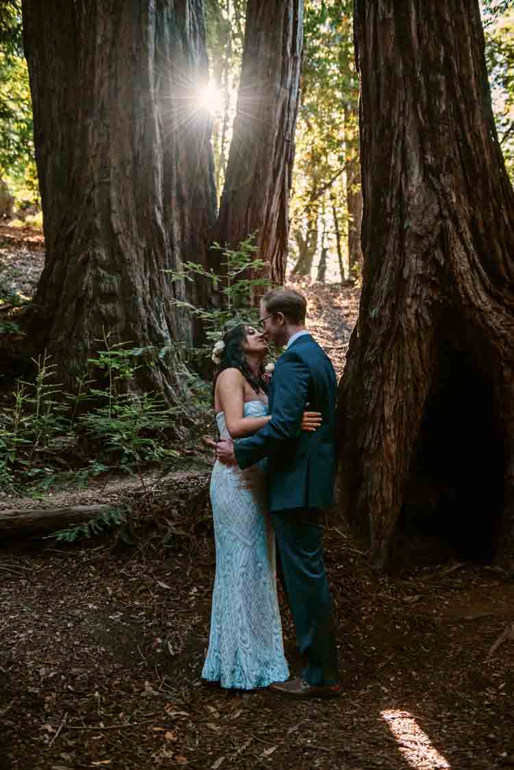 A bride and groom in a forest