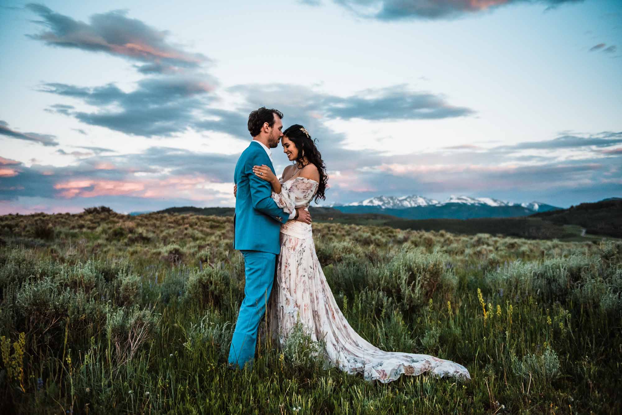 bride and groom being photographed during an elopement in colorado