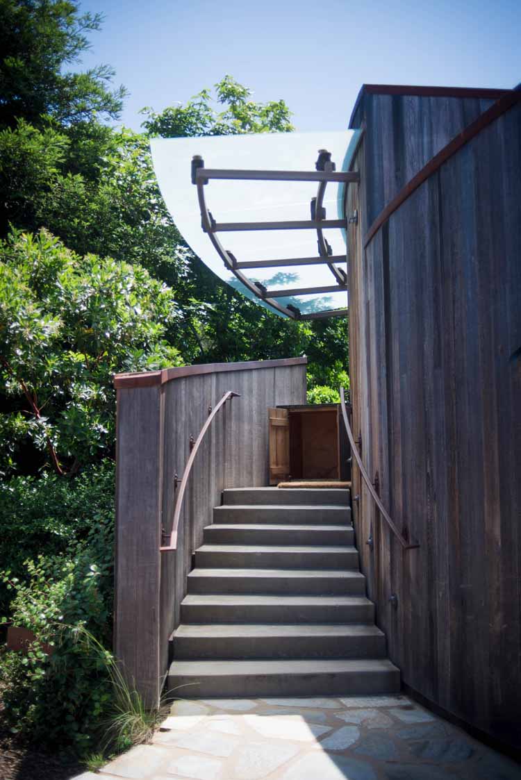 stairs leading into an accommodation option in Big Sur surrounded by trees and nature