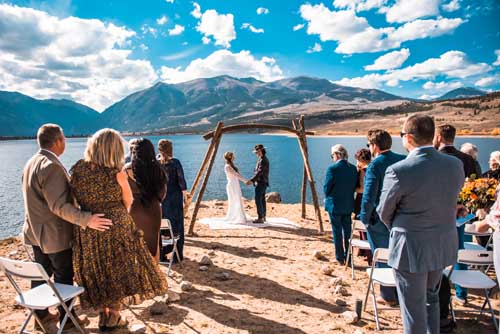 A bride and groom getting married during an elopement on lake tahoe