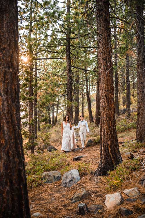 A couple walking through the lake tahoe forest during an elopement